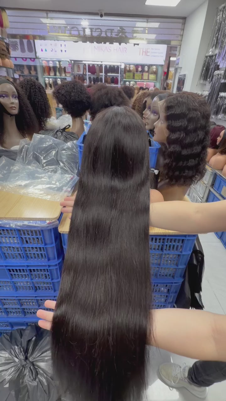 Real factory video of the BONANZA Natural Black Straight 13x4 Lace Front Human Hair Wig showing length, cap construction and lace hairline